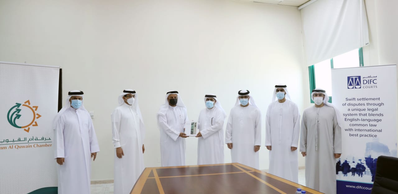 توقيع مذكرة تفاهم بين غرفة تجارة وصناعة أم القيوين و محاكم مركز دبي المالي العالمي